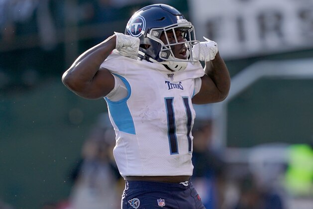 OAKLAND, CALIFORNIA - DECEMBER 08: A.J. Brown #11 of the Tennessee Titans celebrates after he scored a touchdown against the Oakland Raiders during the first half of an NFL football game at RingCentral Coliseum on December 08, 2019 in Oakland, California. (Photo by Thearon W. Henderson/Getty Images)