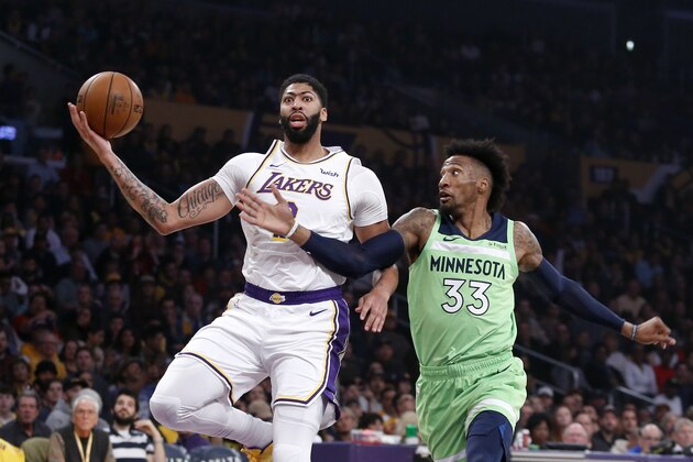 Los Angeles Lakers' Anthony Davis (3) drives to basket while defended by Minnesota Timberwolves' Robert Covington (33) during the first half of an NBA basketball game, Sunday, Dec. 8, 2019, in Los Angeles. (AP Photo/Ringo H.W. Chiu) Los Angeles Lakers' Anthony Davis (3) drives to basket while defended by Minnesota Timberwolves' Robert Covington (33) during the first half of an NBA basketball game, Sunday, Dec. 8, 2019, in Los Angeles. (AP Photo/Ringo H.W. Chiu)