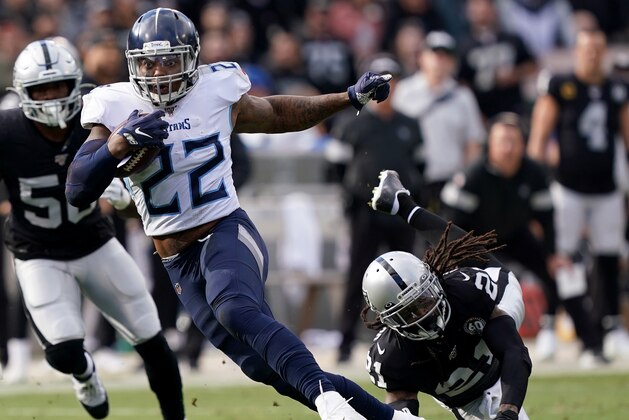 OAKLAND, CALIFORNIA - DECEMBER 08: Derrick Henry #22 of the Tennessee Titans carries the ball against the Oakland Raiders during the first half of an NFL football game at RingCentral Coliseum on December 08, 2019 in Oakland, California. (Photo by Thearon W. Henderson/Getty Images)