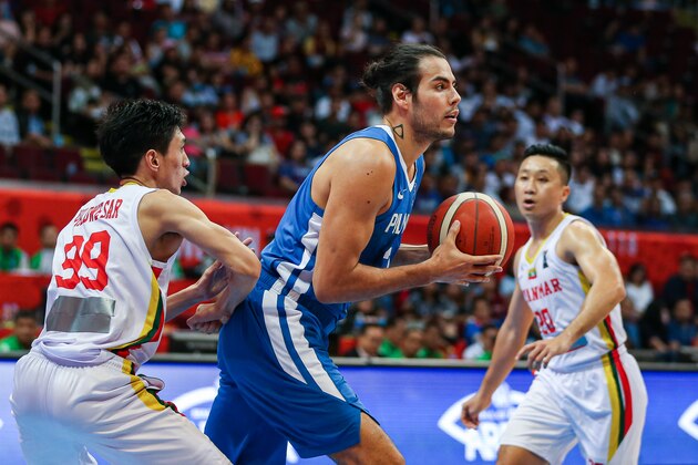 MANILA, PHILIPPINES - DECEMBER 07: Christian Karl Standhardinger #34 of the Philippines handles the ball against Phu Dwe Star #99 of Myanmar during the 5x5 Men's Basketball at the Mall of Asia Arena during day 7 of the Southeast Asian Games on December 07, 2019 in Manila, Philippines. (Photo by Annice Lyn/Getty Images)