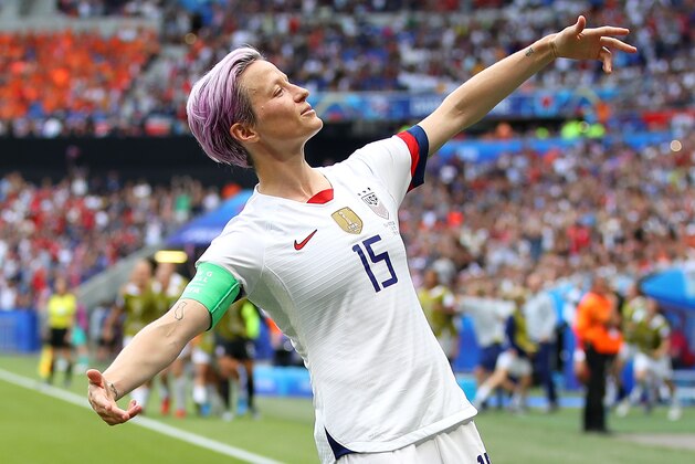 LYON, FRANCE - JULY 07: Megan Rapinoe of the USA celebrates scoring the first goal from the penalty spot during the 2019 FIFA Women's World Cup France Final match between The United State of America and The Netherlands at Stade de Lyon on July 07, 2019 in Lyon, France. (Photo by Richard Heathcote/Getty Images)