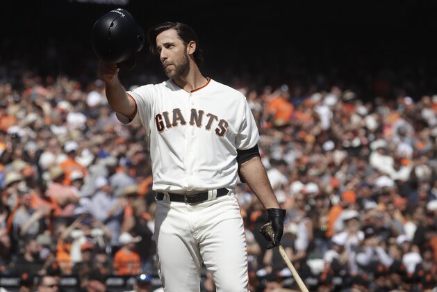 San Francisco Giants' Madison Bumgarner waves toward fans before pinch hitting against the Los Angeles Dodgers during the fifth inning of a baseball game in San Francisco, Sunday, Sept. 29, 2019. (AP Photo/Jeff Chiu)