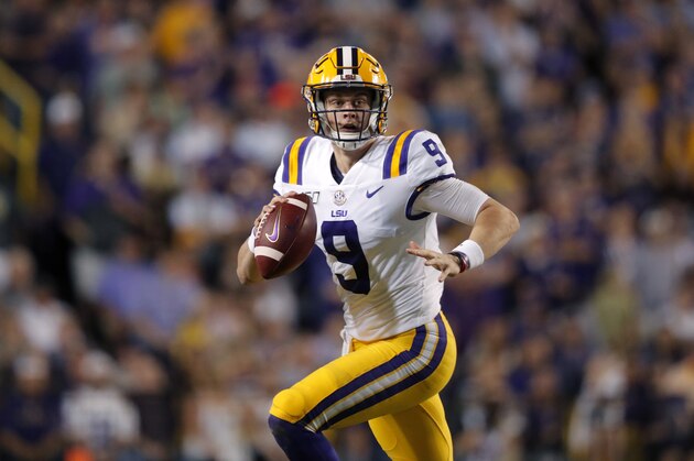LSU quarterback Joe Burrow (9) scrambles in the first half of an NCAA college football game against Texas A&M in Baton Rouge, La., Saturday, Nov. 30, 2019. (AP Photo/Gerald Herbert)