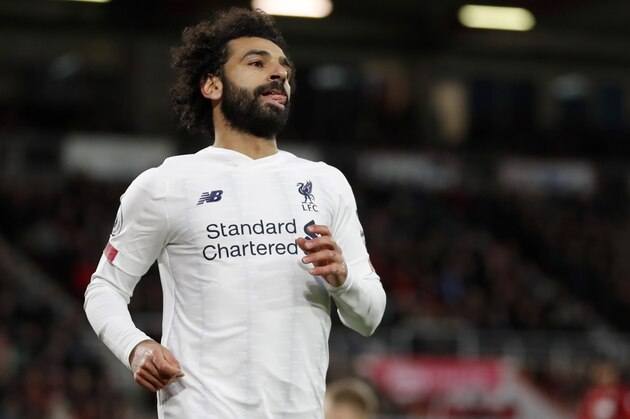 Liverpool's Mohamed Salah, celebrates after scoring his side's third goal during the English Premier League soccer match between Bournemouth and Liverpool at the Vitality stadium in Bournemouth, England, Saturday, Dec. 7, 2019. (AP Photo/Alastair Grant)
