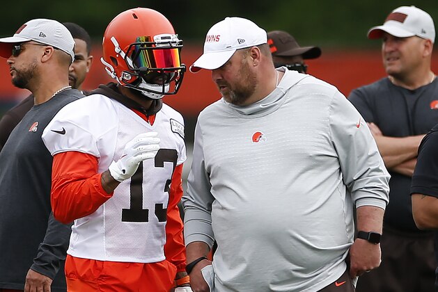 Cleveland Browns wide receiver Odell Beckham Jr. (13) talks with head coach Freddie Kitchens at the team's NFL football training facility in Berea, Ohio, Tuesday, June 4, 2019. (AP Photo/Ron Schwane)