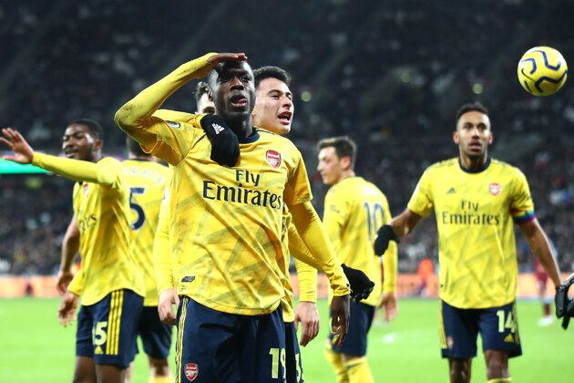 LONDON, ENGLAND - DECEMBER 09: Nicolas Pepe of Arsenal celebrates after scoring his sides second goal during the Premier League match between West Ham United and Arsenal FC at London Stadium on December 09, 2019 in London, United Kingdom. (Photo by Julian Finney/Getty Images)