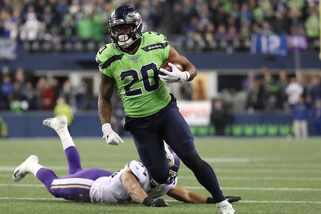 SEATTLE, WASHINGTON - DECEMBER 02: Rashaad Penny #20 of the Seattle Seahawks breaks a tackle against Eric Kendricks #54 of the Minnesota Vikings in the fourth quarter during their game at CenturyLink Field on December 02, 2019 in Seattle, Washington. (Photo by Abbie Parr/Getty Images)