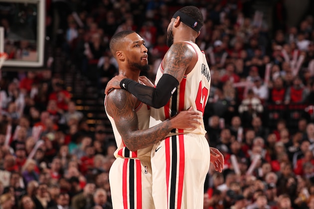 PORTLAND, OR - NOVEMBER 27: Damian Lillard #0 and Carmelo Anthony #00 of the Portland Trail Blazers hug during the game against the Oklahoma City Thunder on November 27, 2019 at the Moda Center Arena in Portland, Oregon. NOTE TO USER: User expressly acknowledges and agrees that, by downloading and or using this photograph, user is consenting to the terms and conditions of the Getty Images License Agreement. Mandatory Copyright Notice: Copyright 2019 NBAE (Photo by Cameron Browne/NBAE via Getty Images)