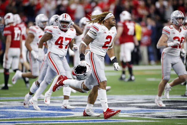 INDIANAPOLIS, IN - DECEMBER 07: Chase Young #2 of the Ohio State Buckeyes celebrates with teammates after a defensive stop against the Wisconsin Badgers during the Big Ten Football Championship at Lucas Oil Stadium on December 7, 2019 in Indianapolis, Indiana. Ohio State defeated Wisconsin 34-21. (Photo by Joe Robbins/Getty Images)