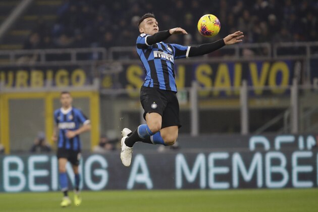 Inter Milan's Lautaro Martinez controls the ball during a Serie A soccer match between Inter Milan and Roma, at the San Siro stadium in Milan, Italy, Friday, Dec.6, 2019. (AP Photo/Luca Bruno)