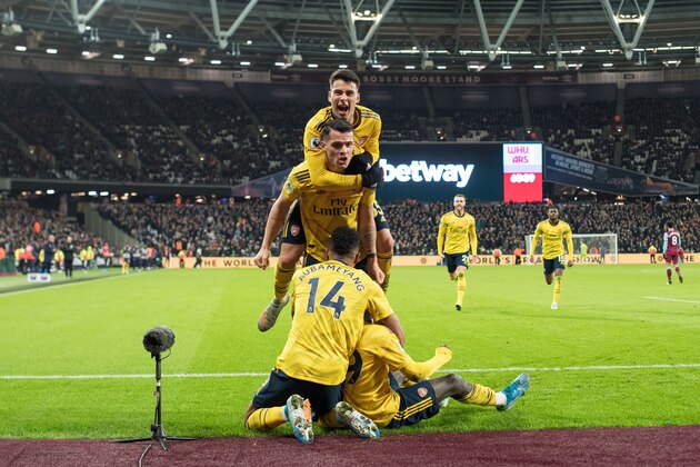 LONDON, ENGLAND - DECEMBER 09: Nicolas Pépé of Arsenal FC celebrate with his teammates Gabriel Martinelli, Pierre-Emerick Aubameyang and Granit Xhaka after scoring goal during the Premier League match between West Ham United and Arsenal FC at London Stadium on December 9, 2019 in London, United Kingdom. (Photo by Sebastian Frej/MB Media/Getty Images)