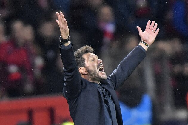 Atletico Madrid coach Diego Simeone gestures during the Champions League, Group D, soccer match between Leverkusen and Atletico Madrid at the BayArena in Leverkusen, Germany, Wednesday, Nov. 6, 2019. (AP Photo/Martin Meissner)