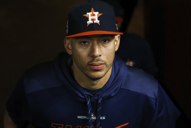 HOUSTON, TX - OCTOBER 30:  Carlos Correa #1 of the Houston Astros walks into the dugout before Game Seven of the 2019 World Series against the Washington Nationals at Minute Maid Park on October 30, 2019 in Houston, Texas.  (Photo by Tim Warner/Getty Images)