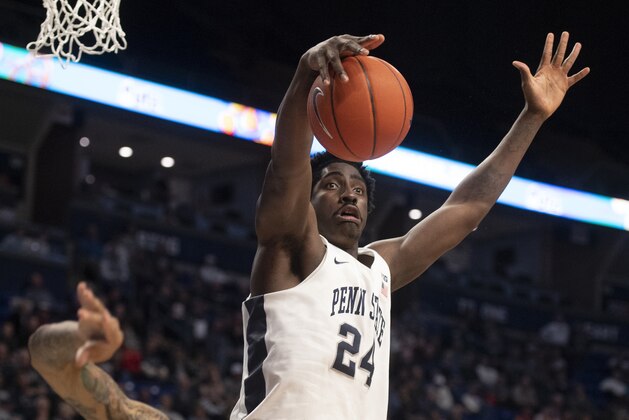 Penn State forward Mike Watkins (24) hauls in a rebound over Maryland guard Eric Ayala (5) the first half of an NCAA college basketball game in State College, Pa., on Tuesday, Dec. 10, 2019. (AP Photo/Barry Reeger)