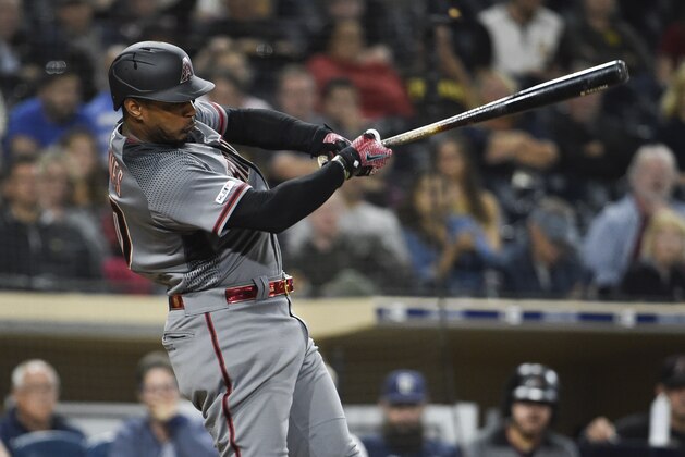 SAN DIEGO, CA - SEPTEMBER 20: Adam Jones #10 of the Arizona Diamondbacks hits an RBI single during the the eighth inning of a baseball game against the San Diego Padres at Petco Park September 20, 2019 in San Diego, California.  (Photo by Denis Poroy/Getty Images)
