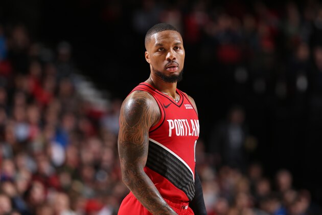 PORTLAND, OR - DECEMBER 10: Damian Lillard #0 of the Portland Trail Blazers looks on against the New York Knicks on December 10, 2019 at the Moda Center in Portland, Oregon. NOTE TO USER: User expressly acknowledges and agrees that, by downloading and or using this Photograph, user is consenting to the terms and conditions of the Getty Images License Agreement. Mandatory Copyright Notice: Copyright 2019 NBAE (Photo by Sam Forencich/NBAE via Getty Images)