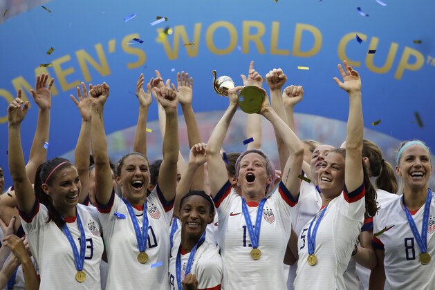 United States' Megan Rapinoe lifts up a trophy after winning the Women's World Cup final soccer match between US and The Netherlands at the Stade de Lyon in Decines, outside Lyon, France, Sunday, July 7, 2019. (AP Photo/Alessandra Tarantino)