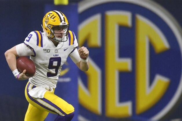 FILE - In this Dec. 7, 2019, file photo, LSU quarterback Joe Burrow (9) runs against Georgia during the second half of the Southeastern Conference championship NCAA college football game, in Atlanta. Burrow is a unanimous selection as the offensive player of the year on The Associated Press All-Southeastern Conference football team, Monday, Dec. 9, 2019. (AP Photo/Mike Stewart, File)