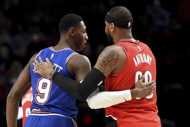 New York Knicks forward RJ Barrett, left, greets Portland Trail Blazers forward Carmelo Anthony before an NBA basketball game in Portland, Ore., Tuesday, Dec. 10, 2019. (AP Photo/Steve Dykes) New York Knicks forward RJ Barrett, left, greets Portland Trail Blazers forward Carmelo Anthony before an NBA basketball game in Portland, Ore., Tuesday, Dec. 10, 2019. (AP Photo/Steve Dykes)