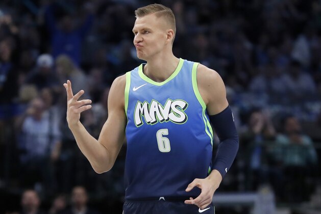 Dallas Mavericks forward Kristaps Porzingis (6) celebrates sinking a 3-point basket in the first half of an NBA basketball game against the Los Angeles Clippers in Dallas, Tuesday, Nov. 26, 2019. (AP Photo/Tony Gutierrez)