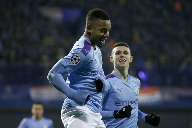 Manchester City's Gabriel Jesus, front, celebrates with Manchester City's Phil Foden after scoring his side's second goal during the Champions League group C soccer match between Dinamo Zagreb and Manchester City at Maksimir Stadium in Zagreb, Croatia, Wednesday, Dec. 11, 2019. (AP Photo/Darko Bandic)