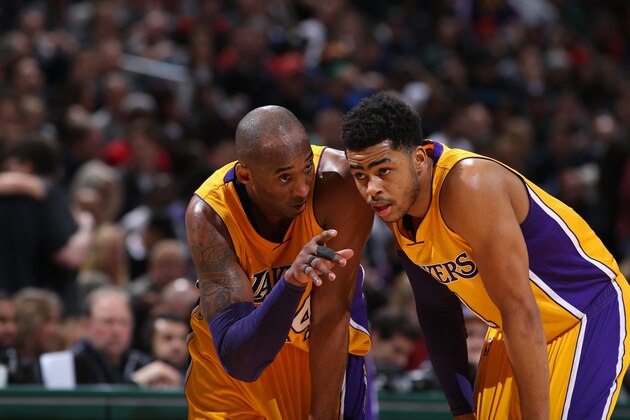 MILWAUKEE, WI - FEBRUARY 22:  Kobe Bryant #24 and D'Angelo Russell #1 of the Los Angeles Lakers talk during the game against the Milwaukee Bucks on February 22, 2016 at the BMO Harris Bradley Center in Milwaukee, Wisconsin. NOTE TO USER: User expressly acknowledges and agrees that, by downloading and or using this Photograph, user is consenting to the terms and conditions of the Getty Images License Agreement. Mandatory Copyright Notice: Copyright 2016 NBAE (Photo by Gary Dineen/NBAE via Getty Images)