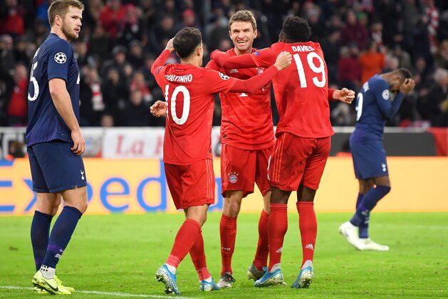 MUNICH, GERMANY - DECEMBER 11: Thomas Muller of FC Bayern Munich celebrates after scoring his team's second goal with Philippe Coutinho and Alphonso Davies during the UEFA Champions League group B match between Bayern Muenchen and Tottenham Hotspur at Allianz Arena on December 11, 2019 in Munich, Germany. (Photo by Michael Regan/Getty Images)