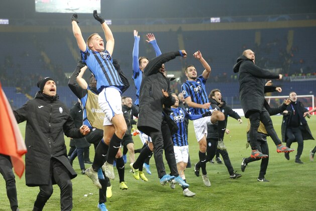 Atalanta players celebrate their victory after the Group C Champions League soccer match between FC Shakhtar Donetsk and Atalanta in Kharkiv, Ukraine, Wednesday, Dec. 11, 2019. (AP Photo/Efrem Lukatsky)