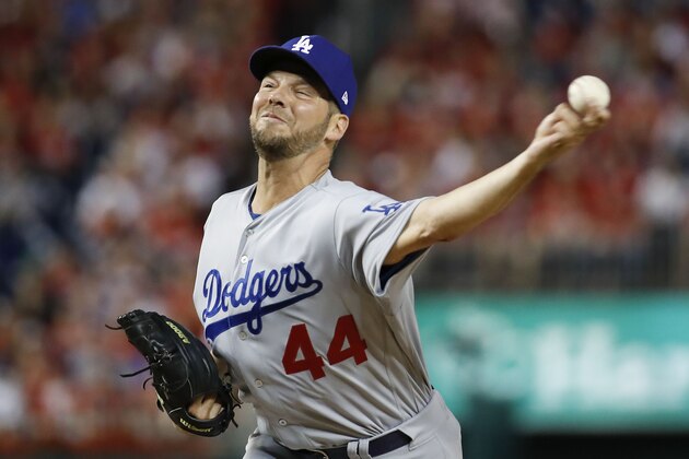 Los Angeles Dodgers starting pitcher Rich Hill throws against the Washington Nationals during the first inning in Game 4 of a baseball National League Division Series, Monday, Oct. 7, 2019, in Washington. (AP Photo/Alex Brandon)