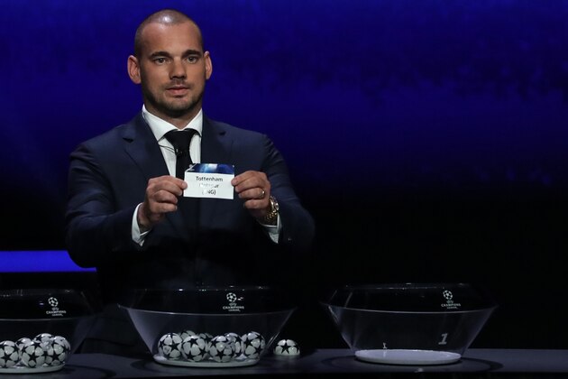 Former Dutch international Wesley Sneijder holds the slip of Tottenham Hotspur during the UEFA Champions League football group stage draw ceremony in Monaco on August 29, 2019. (Photo by Valery HACHE / AFP)        (Photo credit should read VALERY HACHE/AFP via Getty Images)