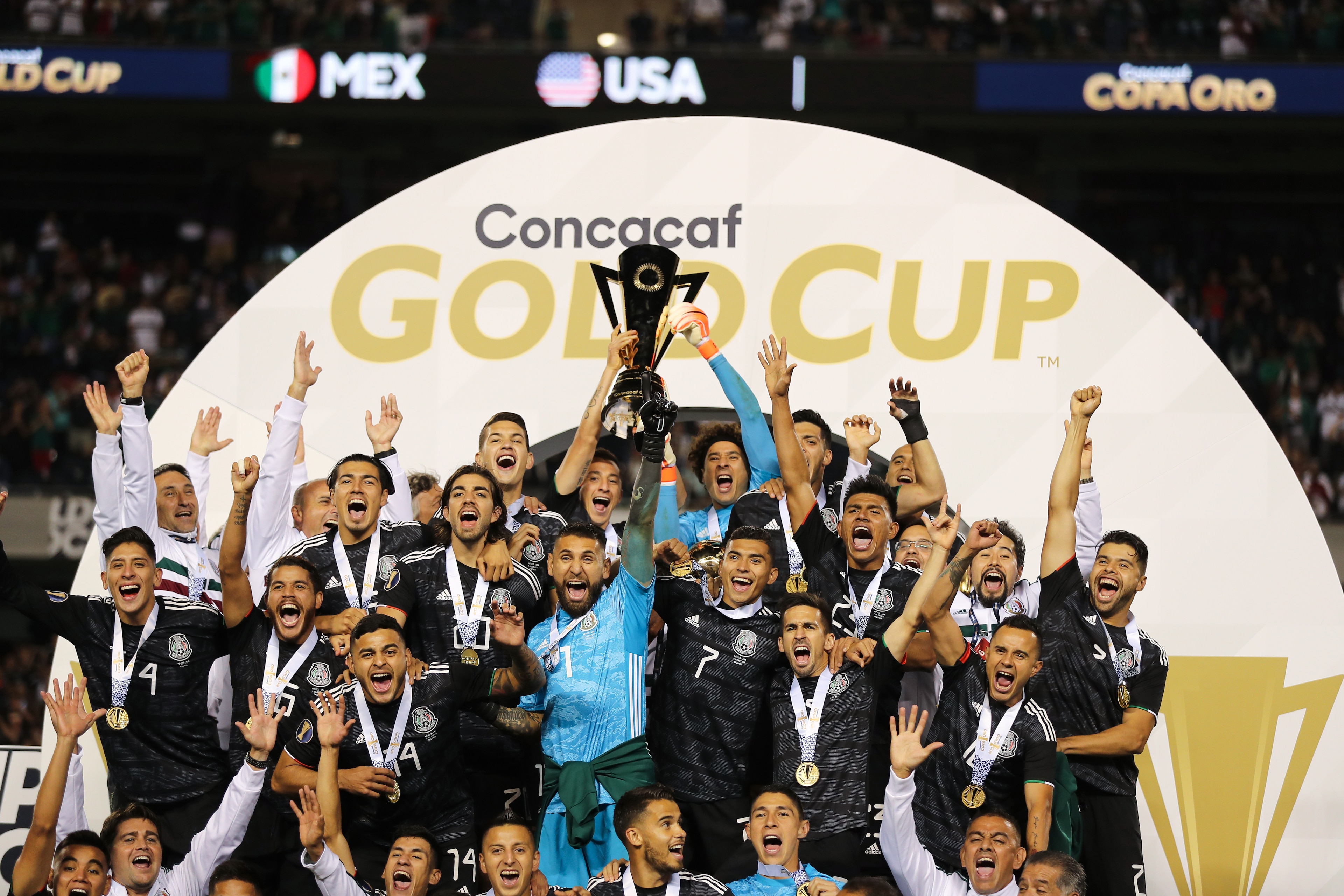 CHICAGO, IL - JULY 07: Mexico players celebrate with the CONCACAF Gold Cup trophy after their 1-0 victory over USA in the 2019 CONCACAF Gold Cup Final between Mexico and United States of America at Soldier Field on July 7, 2019 in Chicago, Illinois. (Photo by Matthew Ashton - AMA/Getty Images)