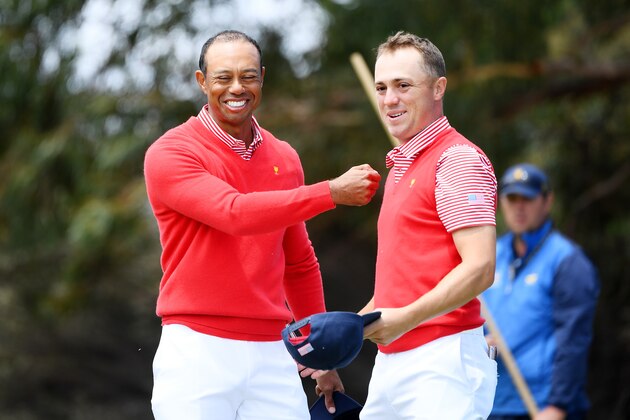 MELBOURNE, AUSTRALIA - DECEMBER 12: Playing Captain Tiger Woods of the United States team and Justin Thomas of the United States team celebrate defeating Marc Leishman of Australia and the International team and Joaquin Niemann of Chile and the International team 4&3 on the 15th green during Thursday four-ball matches on day one of the 2019 Presidents Cup at Royal Melbourne Golf Course on December 12, 2019 in Melbourne, Australia. (Photo by Quinn Rooney/Getty Images)