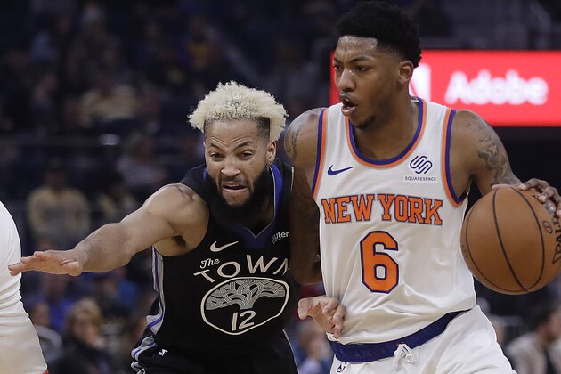 New York Knicks' Elfrid Payton, right, drives the ball against Golden State Warriors' Ky Bowman (12) in the first half of an NBA basketball game, Wednesday, Dec. 11, 2019, in San Francisco. (AP Photo/Ben Margot)