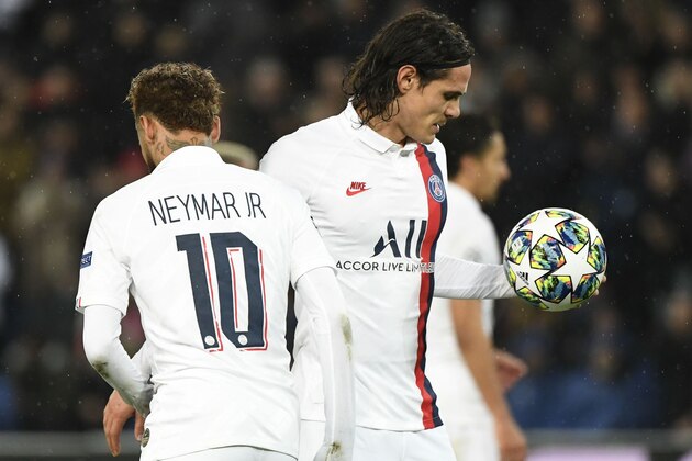 Paris Saint-Germain's Uruguayan forward Edinson Cavani (R) receives the football from Paris Saint-Germain's Brazilian forward Neymar before shoot the penalty kick the UEFA Champions League Group A football match between Paris Saint-Germain (PSG) and Galatasaray at the Parc des Princes stadium in Paris on December 11, 2019. (Photo by Bertrand GUAY / AFP) (Photo by BERTRAND GUAY/AFP via Getty Images)