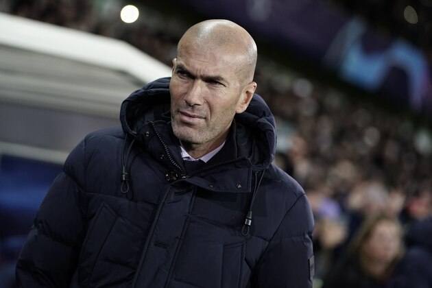 Real Madrid's French coach Zinedine Zidane looks on before the UEFA Champions League Group A football match between Club Brugge and Real Madrid CF at the Jan Breydel Stadium in Bruges on December 11, 2019. (Photo by KENZO TRIBOUILLARD / AFP) (Photo by KENZO TRIBOUILLARD/AFP via Getty Images)