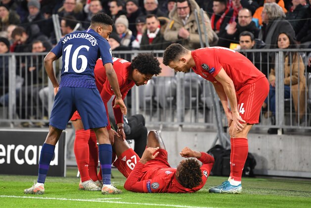 MUNICH, GERMANY - DECEMBER 11: Kingsley Coman of FC Bayern Munich reacts on the ground after going down injured during the UEFA Champions League group B match between Bayern Muenchen and Tottenham Hotspur at Allianz Arena on December 11, 2019 in Munich, Germany. (Photo by Michael Regan/Getty Images)