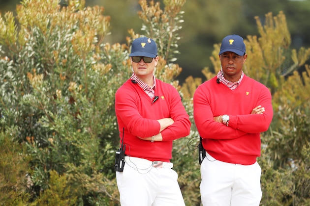 MELBOURNE, AUSTRALIA - DECEMBER 12: Playing Captain Tiger Woods of the United States team and Assistant Captain Zach Johnson of the United States team look on during Thursday four-ball matches on day one of the 2019 Presidents Cup at Royal Melbourne Golf Course on December 12, 2019 in Melbourne, Australia. (Photo by Rob Carr/Getty Images)