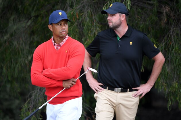 US team captain Tiger Woods (L) and International team player Marc Leishman of Australia looks on during day one of the Presidents Cup golf tournament in Melbourne on December 12, 2019. (Photo by William WEST / AFP) / -- IMAGE RESTRICTED TO EDITORIAL USE - STRICTLY NO COMMERCIAL USE -- (Photo by WILLIAM WEST/AFP via Getty Images)