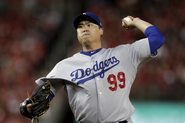 Los Angeles Dodgers starting pitcher Hyun-Jin Ryu throws a pitch to a Washington Nationals batter during the first inning in Game 3 of a baseball National League Division Series Sunday, Oct. 6, 2019, in Washington. (AP Photo/Julio Cortez)