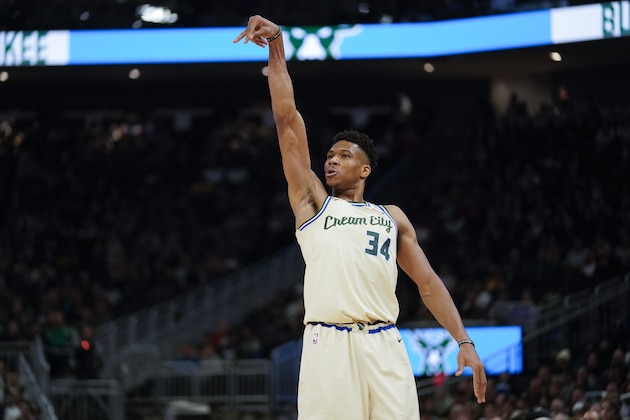 Milwaukee Bucks' Giannis Antetokounmpo reacts to his three-point basket during the second half of an NBA basketball game against the Orlando Magic Monday, Dec. 9, 2019, in Milwaukee. The Bucks won 110-101. (AP Photo/Morry Gash)
