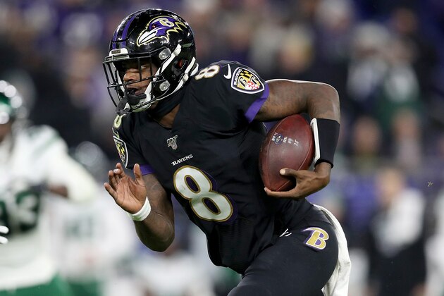 BALTIMORE, MARYLAND - DECEMBER 12: Quarterback Lamar Jackson #8 of the Baltimore Ravens carries the ball against defense of the New York Jets during the game at M&T Bank Stadium on December 12, 2019 in Baltimore, Maryland. (Photo by Patrick Smith/Getty Images)