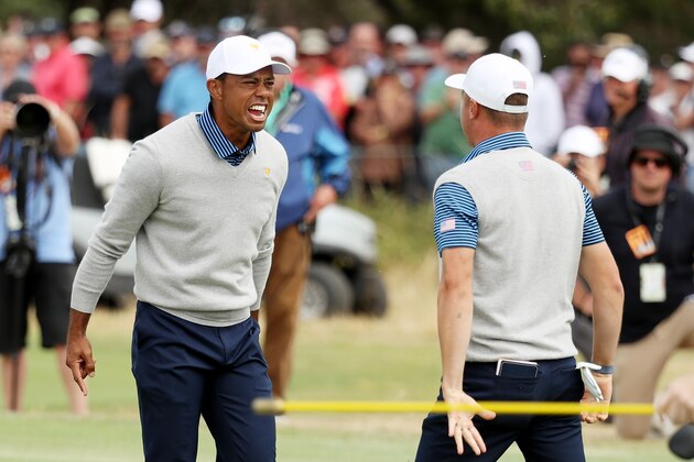 MELBOURNE, AUSTRALIA - DECEMBER 13: Playing Captain Tiger Woods of the United States team and Justin Thomas of the United States team celebrate defeating Byeong-Hun An of South Korea and the International team and Hideki Matsuyama of Japan and the International team 1up on the 18th green during Friday foursome matches on day two of the 2019 Presidents Cup at Royal Melbourne Golf Course on December 13, 2019 in Melbourne, Australia. (Photo by Rob Carr/Getty Images)