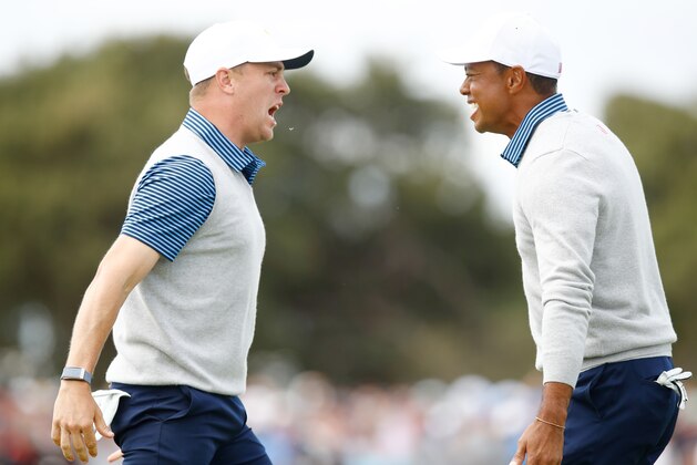 MELBOURNE, AUSTRALIA - DECEMBER 13: Playing Captain Tiger Woods of the United States team and Justin Thomas of the United States team celebrate defeating Byeong-Hun An of South Korea and the International team and Hideki Matsuyama of Japan and the International team 1up on the 18th green during Friday foursome matches on day two of the 2019 Presidents Cup at Royal Melbourne Golf Course on December 13, 2019 in Melbourne, Australia. (Photo by Daniel Pockett/Getty Images)