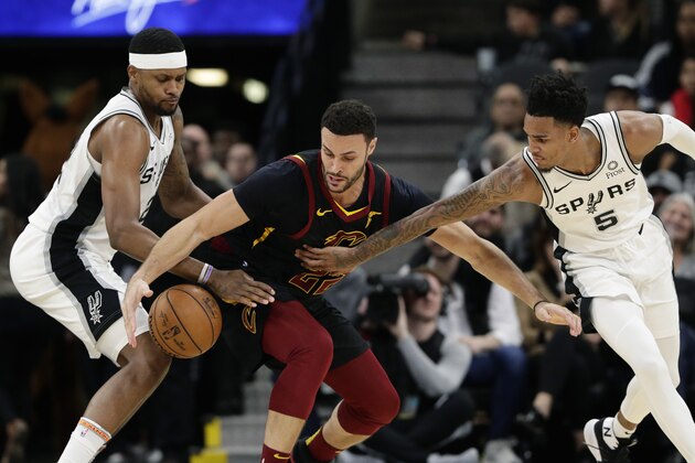 Cleveland Cavaliers forward Larry Nance Jr., center, is pressured by San Antonio Spurs forward Rudy Gay, left, and guard Dejounte Murray (5) during the first half of an NBA basketball game, in San Antonio, Thursday, Dec. 12, 2019. (AP Photo/Eric Gay) Cleveland Cavaliers forward Larry Nance Jr., center, is pressured by San Antonio Spurs forward Rudy Gay, left, and guard Dejounte Murray (5) during the first half of an NBA basketball game, in San Antonio, Thursday, Dec. 12, 2019. (AP Photo/Eric Gay)