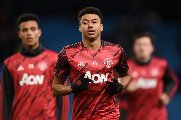 Manchester United's English midfielder Jesse Lingard (C) warms up for the English Premier League football match between Manchester City and Manchester United at the Etihad Stadium in Manchester, north west England, on December 7, 2019. (Photo by Oli SCARFF / AFP) / RESTRICTED TO EDITORIAL USE. No use with unauthorized audio, video, data, fixture lists, club/league logos or 'live' services. Online in-match use limited to 120 images. An additional 40 images may be used in extra time. No video emulation. Social media in-match use limited to 120 images. An additional 40 images may be used in extra time. No use in betting publications, games or single club/league/player publications. /  (Photo by OLI SCARFF/AFP via Getty Images)