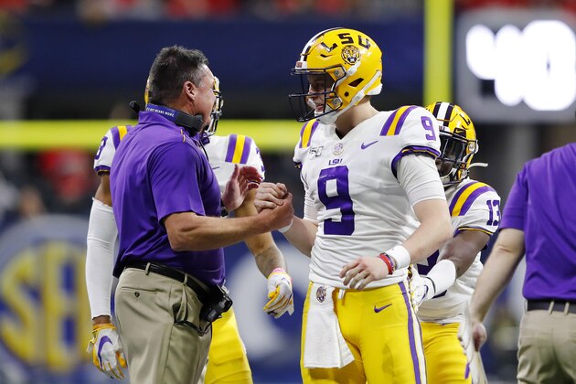 ATLANTA, GEORGIA - DECEMBER 07: Head coach Ed Orgeron of the LSU Tigers talks with Joe Burrow #9 in the second half against the Georgia Bulldogs during the SEC Championship game at Mercedes-Benz Stadium on December 07, 2019 in Atlanta, Georgia. (Photo by Kevin C. Cox/Getty Images) ATLANTA, GEORGIA - DECEMBER 07: Head coach Ed Orgeron of the LSU Tigers talks with Joe Burrow #9 in the second half against the Georgia Bulldogs during the SEC Championship game at Mercedes-Benz Stadium on December 07, 2019 in Atlanta, Georgia. (Photo by Kevin C. Cox/Getty Images)