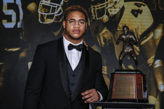 Ohio State defensive end Chase Young poses with the The 2019 Bronko Nagurski Award before the awards banquet in Charlotte, N.C., Monday, Dec. 9, 2019. (AP Photo/Nell Redmond)
