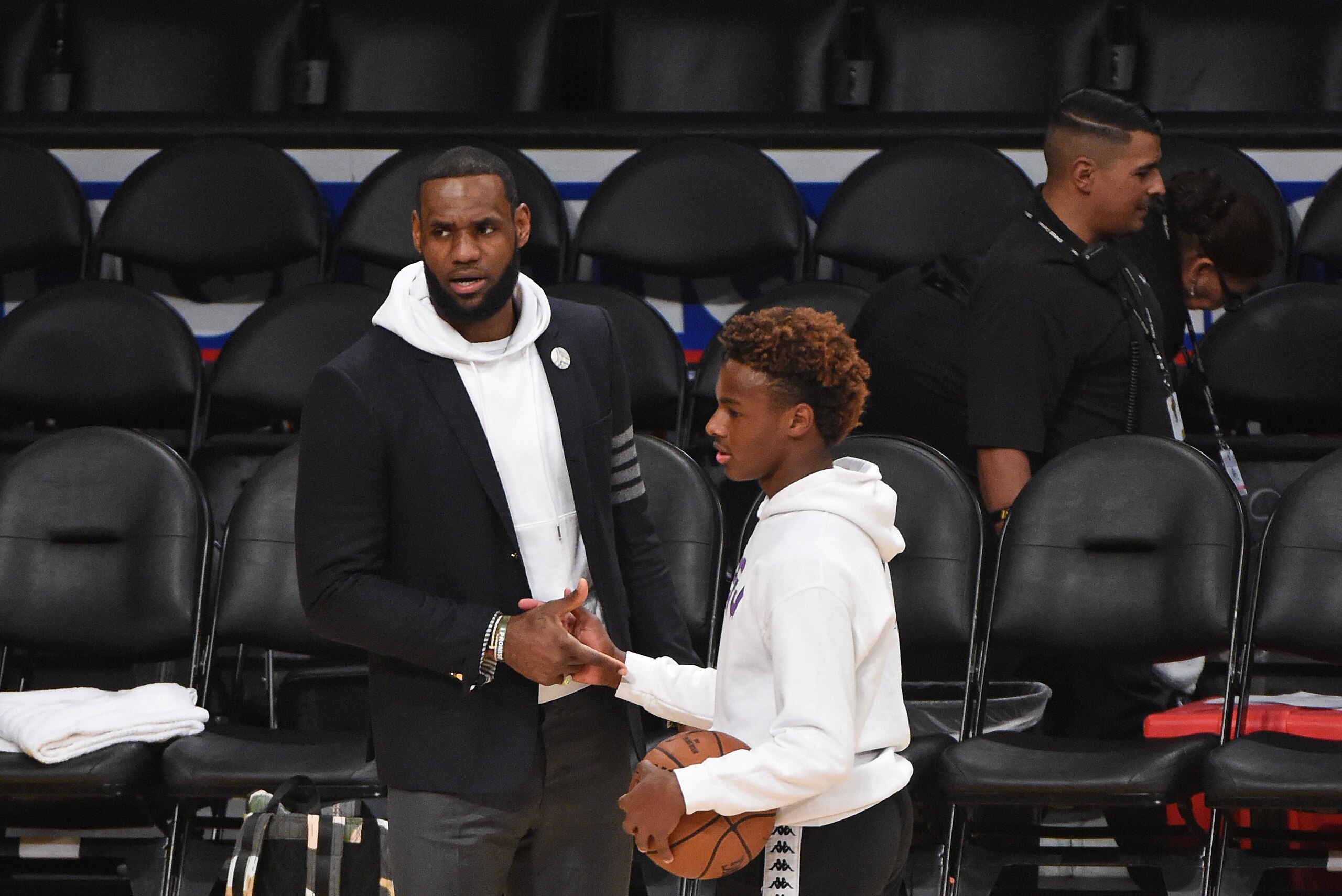LOS ANGELES, CA - DECEMBER 28: LeBron James #23 of the Los Angeles Lakers and LeBron James Jr. high-five after a game between the LA Clippers and the Los Angeles Lakers on December 28, 2018 at STAPLES Center in Los Angeles, California. NOTE TO USER: User expressly acknowledges and agrees that, by downloading and/or using this photograph, user is consenting to the terms and conditions of the Getty Images License Agreement. Mandatory Copyright Notice: Copyright 2018 NBAE (Photo by Adam Pantozzi/NBAE via Getty Images)