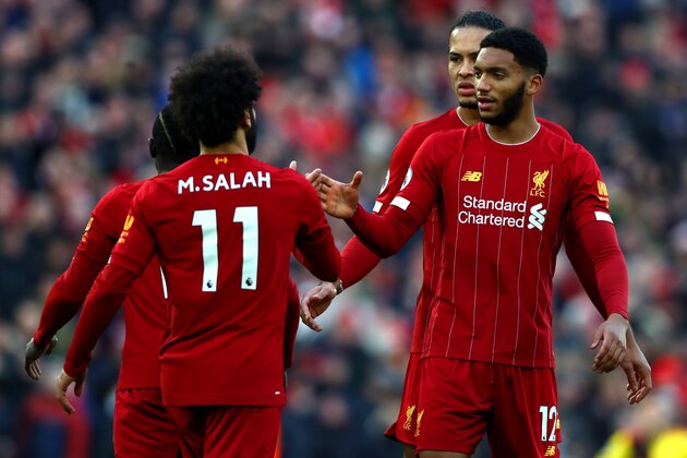 LIVERPOOL, ENGLAND - DECEMBER 14: Mohamed Salah of Liverpool celebrates scoring his teams first goal during the Premier League match between Liverpool FC and Watford FC at Anfield on December 14, 2019 in Liverpool, United Kingdom. (Photo by Chloe Knott - Danehouse/Getty Images)