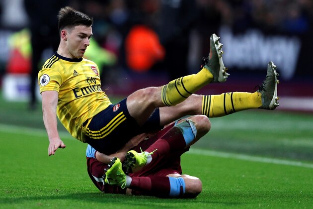 Arsenal's Scottish defender Kieran Tierney (L) clashes with West Ham United's Scottish midfielder Robert Snodgrass during the English Premier League football match between West Ham United and Arsenal at The London Stadium, in east London on December 9, 2019. (Photo by Adrian DENNIS / AFP) / RESTRICTED TO EDITORIAL USE. No use with unauthorized audio, video, data, fixture lists, club/league logos or 'live' services. Online in-match use limited to 120 images. An additional 40 images may be used in extra time. No video emulation. Social media in-match use limited to 120 images. An additional 40 images may be used in extra time. No use in betting publications, games or single club/league/player publications. /  (Photo by ADRIAN DENNIS/AFP via Getty Images)